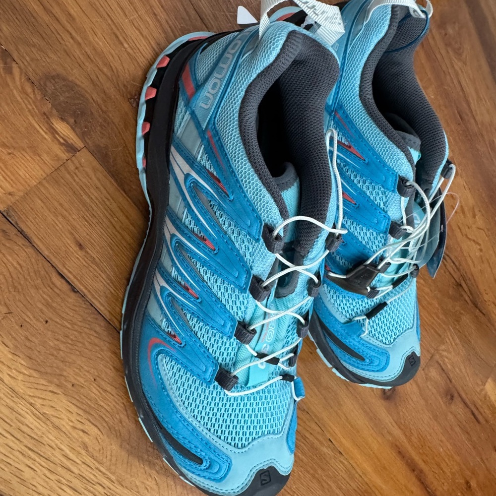 Salomon Vibrant Blue and Black Trail Runners with Red Highlights